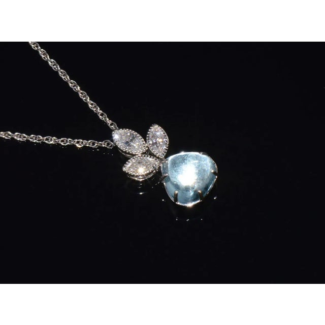 Top quality natural aquamarine and diamond pendant with a gorgeous floral drop design. This finely crafted 18K solid gold...