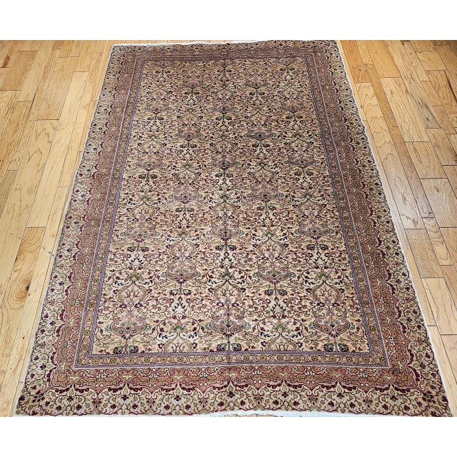 Vintage Turkish Hereke room size rug was artistically handwoven in the mid-20th century in an allover pattern . The...