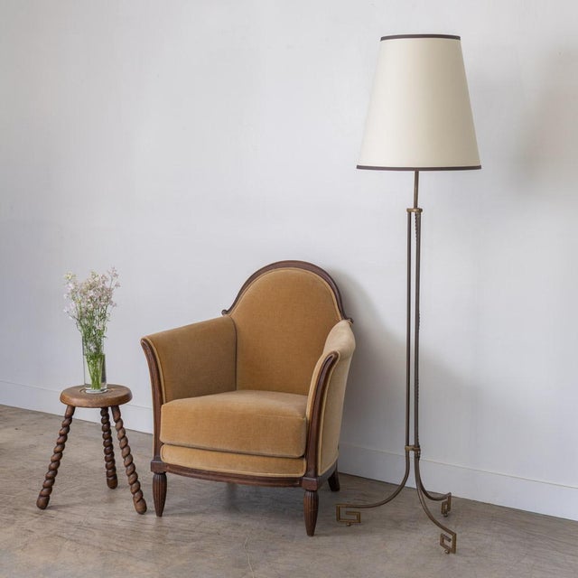 Stunning metal and brass floor lamp from France, 1930s. Black metal body with brass accents and tripod metal base with...