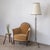 Stunning metal and brass floor lamp from France, 1930s. Black metal body with brass accents and tripod metal base with...