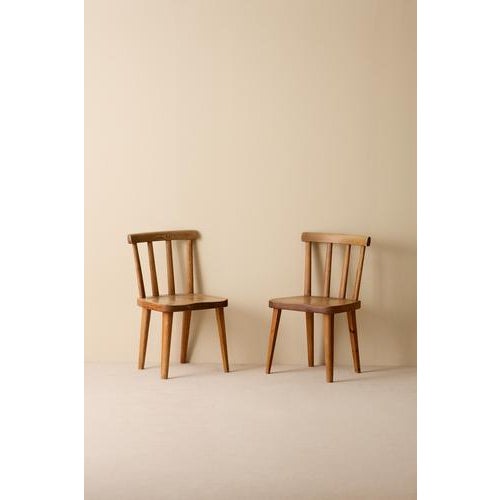 Pair of Utö/Uto pine chairs by Axel-Einar Hjorth, Sweden, circa 1930s. Produced by Nordiska Kompaniet. This piece is...