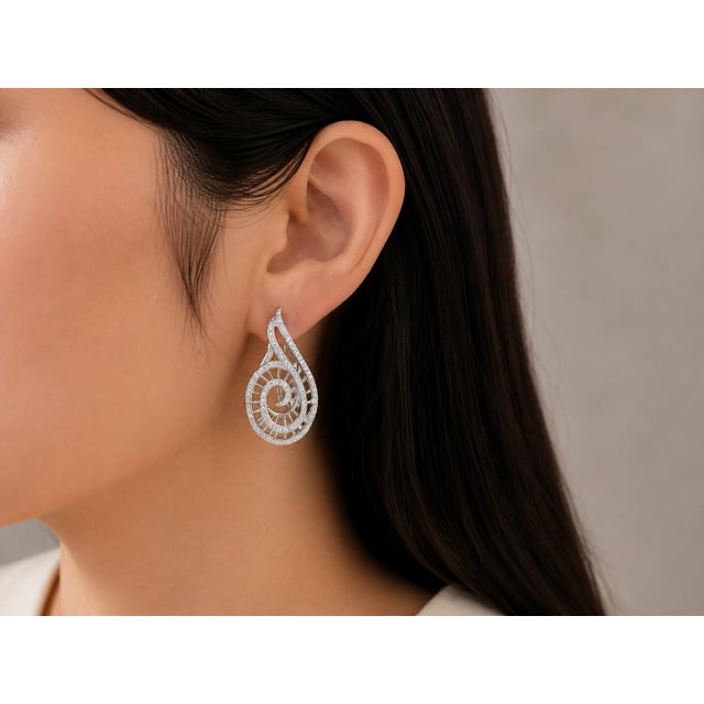These designer French clip earrings are crafted in 18K white gold by Odelia and feature numerous brilliant round white...
