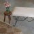 Beautiful iron bench with curved and looped base painted in a matte black finish inspired by French design. Rectangular...