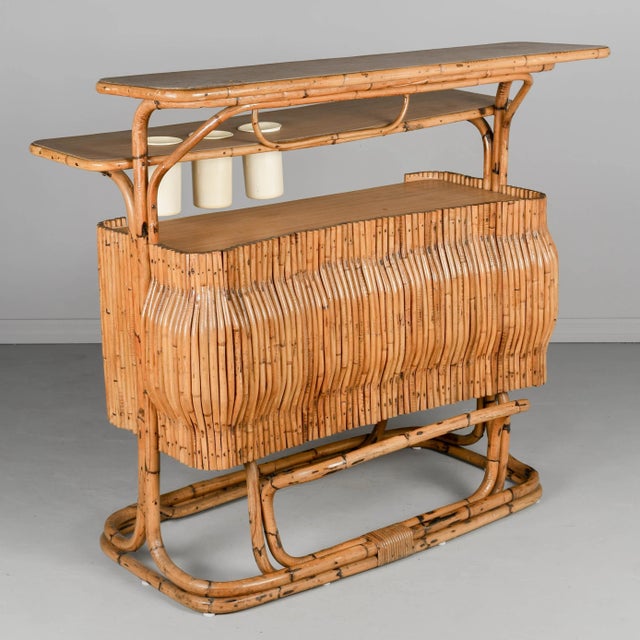 An authentic Mid-Century Modern vintage Italian rattan tiki bar. Produced in Italy during the 1950s-1960s, this iconic...