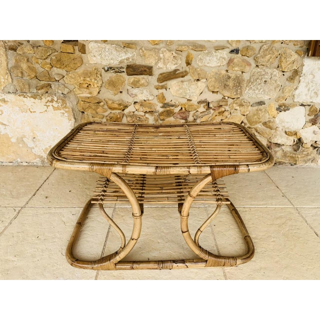 Mid-century coffee table with magazine rack circa 1960s table is made of bamboo and rattan showcasing wonderful bentwood...