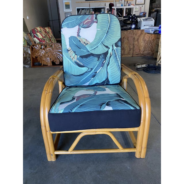 Two-strand "1940s Transition" rattan lounge chair. The chair features an arm style that flows simultaneously into the...