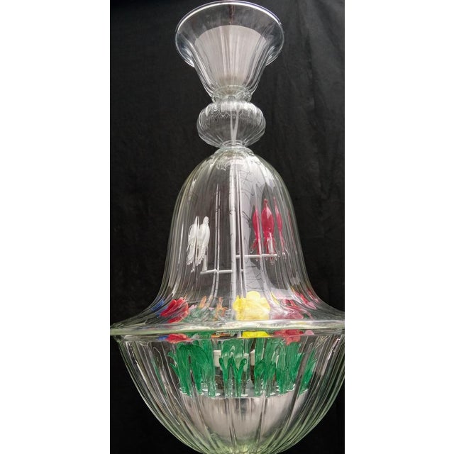 Venetian lantern in blown murano glass and handmade, cage with birds and garden with colored flowers in glass paste and...