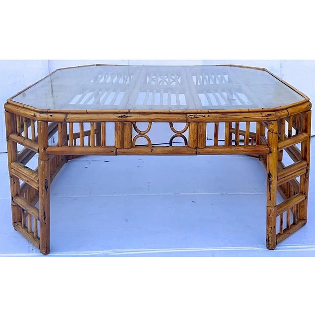 This is a gorgeous, vintage English Brighton style burnt bamboo coffee table with glass top. The shape of this particular...