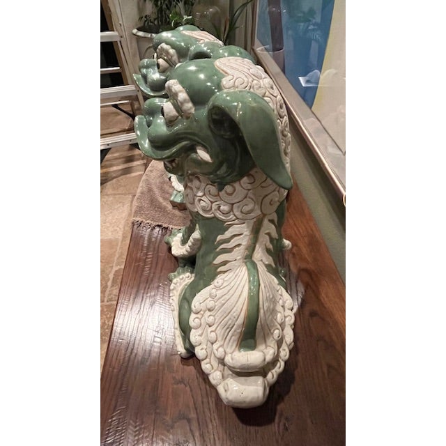 A striking and substantial pair of vintage ceramic Chinese guardian lions (Foo Dogs), beautifully crafted and finished in...
