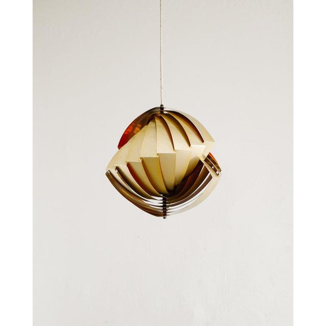 A rare, early and original danish mid century "konkylie / tivoli" ceiling lamp pendant in patinated brass with a colorful...