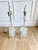 An exceptional, substantial pair of sculptural stacked lucite table lamps dating to the 1970s, distinguished by their...