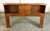 This full size bookcase headboard features a warm wood finish with two open storage cubbies and a pair of centered drawers...
