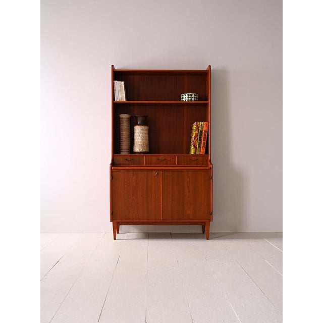 1960s mobile with desk and shelf. An original '60s piece of furniture of Scandinavian manufacturing. In the lower part...