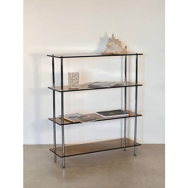 Small 70's shelf, chromed steel structure, adjustable feet, brown transparent glass shelves, completely disassembled, the...
