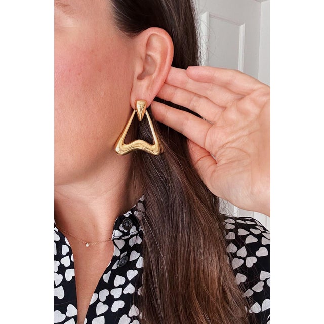 What Makes This Pair Special A sleek statement earring that’s easy to wear on pierced ears without the weight of a heavier...