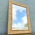 Charming vintage wall mirror featuring a natural woven wicker frame accented with smooth rattan trim. The rectangular...