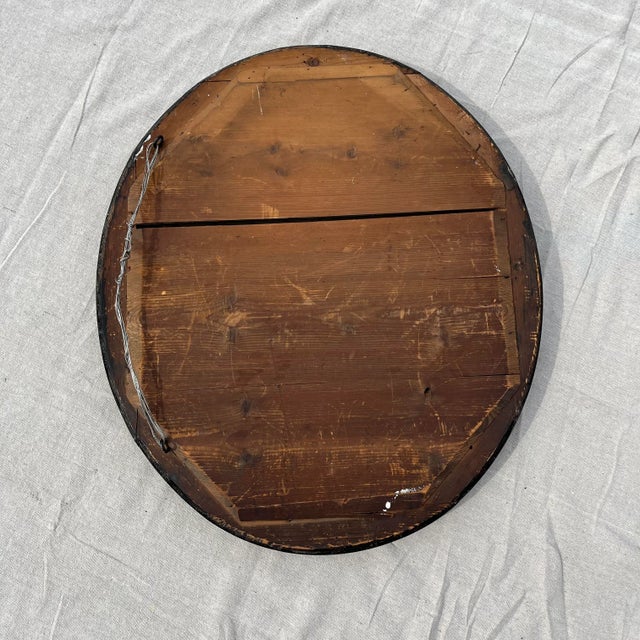 French Louis Philippe black mirror with gilded accents. Most mirrors from this era are completely gilded, making this...