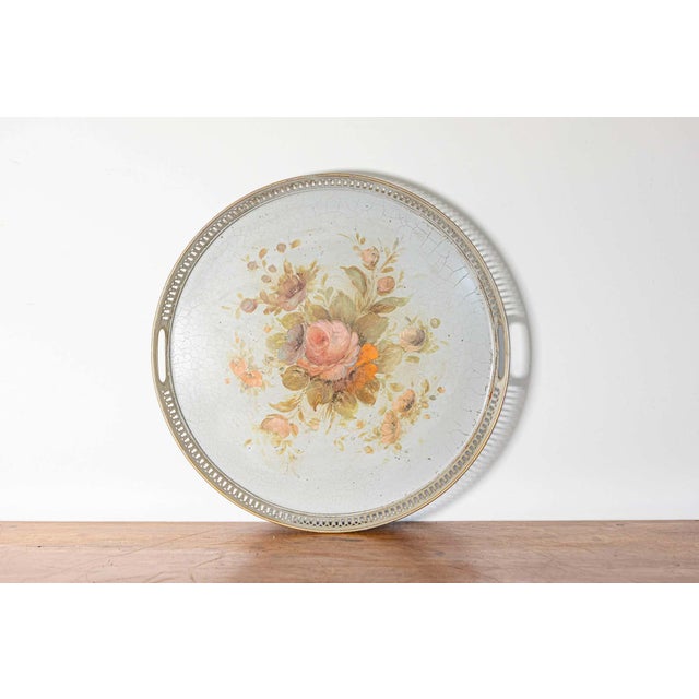 This elegant 19th-century French painted sheet metal tray is a stunning example of antique decorative craftsmanship. The...