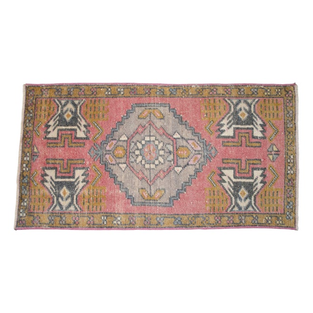 a Vintage Turkish Small yastik rug, red background rug perfect for entryway, bath or in front of the kitchen sink....