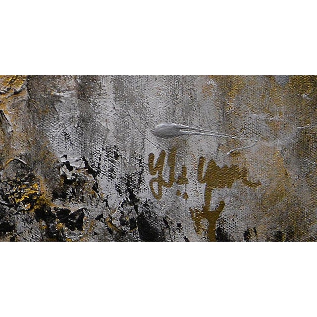This striking abstract painting by Yasmen, titled "Golden Abyss," captivates with its dramatic interplay of gold, black,...