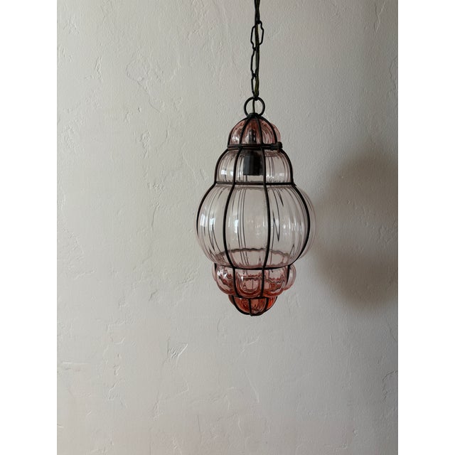 Each housing one-light. These were purchased from Sharon Osbourne's estate sell in Las Vegas. Very light pink Murano...