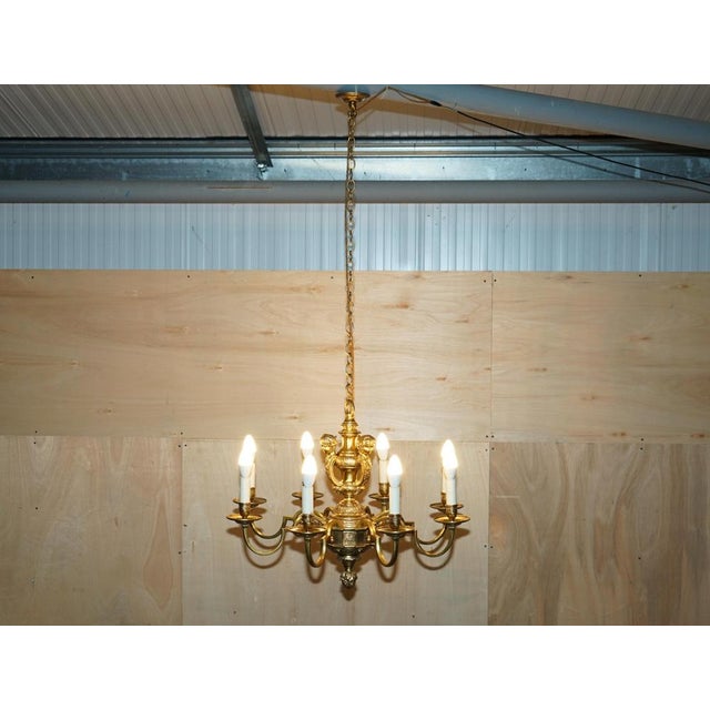We are delighted to offer for sale this exquisite circa 1900 French solid gilt brass Rococo ceiling chandelier depicting...