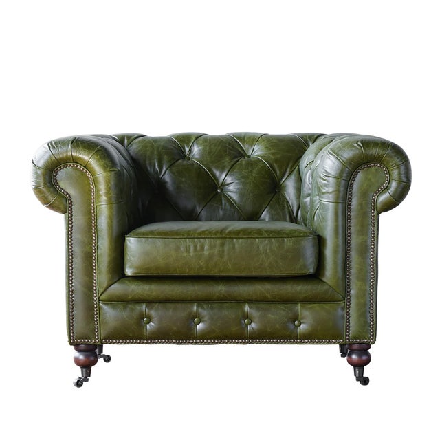 Upholstered in rich Brazilian cowhide leather, this collection stands out with its distinctive Great Britain racing green...