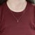 Elegant Madagascar Ruby Pendant featuring a vibrant round 4.5mm natural ruby, showcasing a rich, deep red hue that...