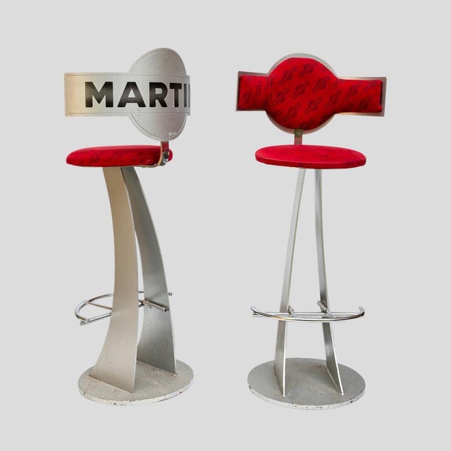 Pair of Vintage solid steel stools with original martini fabric upholstery with Martini inscribe back rest. Made in...