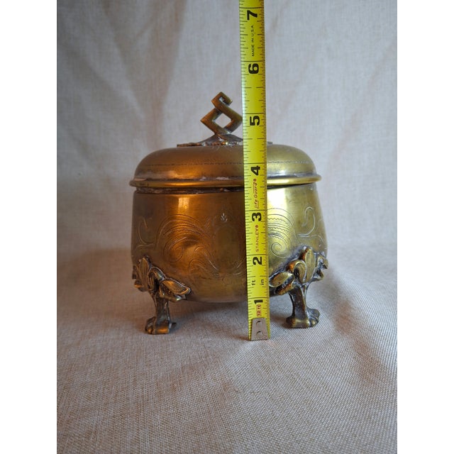 This is an authentic 19th-century Eastern European footed brass Etrog box (Sukkot citron vessel), originally acquired from...