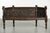 This unique and likely Italian entryway bench dates from the 17th and 18th centuries and features exquisite wood carvings...