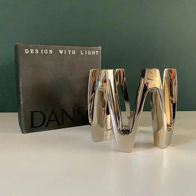 Original Jens Quistgaard silver plate crown candle centerpiece by Dansk. Comes in the original box. Shows a warm aged...