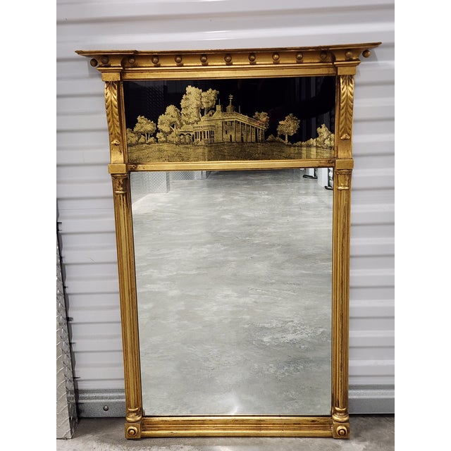 Antique early 20th century Federal style Colonial Revival giltwood mirror, with gold and black eglomise reversed painted...