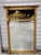 Antique early 20th century Federal style Colonial Revival giltwood mirror, with gold and black eglomise reversed painted...