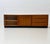 Elegant teak veneer sideboard designed by swiss designer dieter wäckerlin. Its clean, horizontally emphasized design...