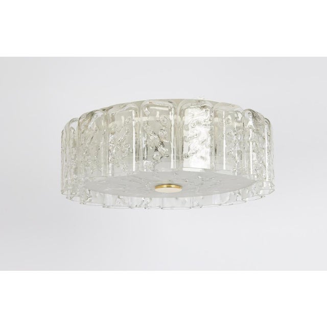 Fantastic mid-century chandelier by doria, germany, manufactured circa 1960-1969. Art glass cylinders are suspended from...