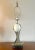 This stunning and substantial vintage table lamp in the manner of Maison Charles features a life-size realistic textured...