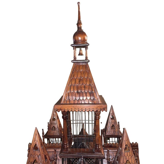 An exceptional and monumental Victorian Gothic Revival bird cage crafted in richly figured mahogany and raised on its...