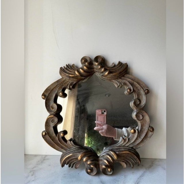 Enhance your home decor with this elegant gold ornate wall mirror. Its intricate design adds a touch of sophistication to...
