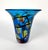 Vintage Murano blue art glass vase with stylized red, orange, and yellow flowers accented with narrow black bands and a...