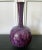 An impressively large ceramic vase with a bulbous body and a long coiled neck by potter Brother Thomas Bezanson...