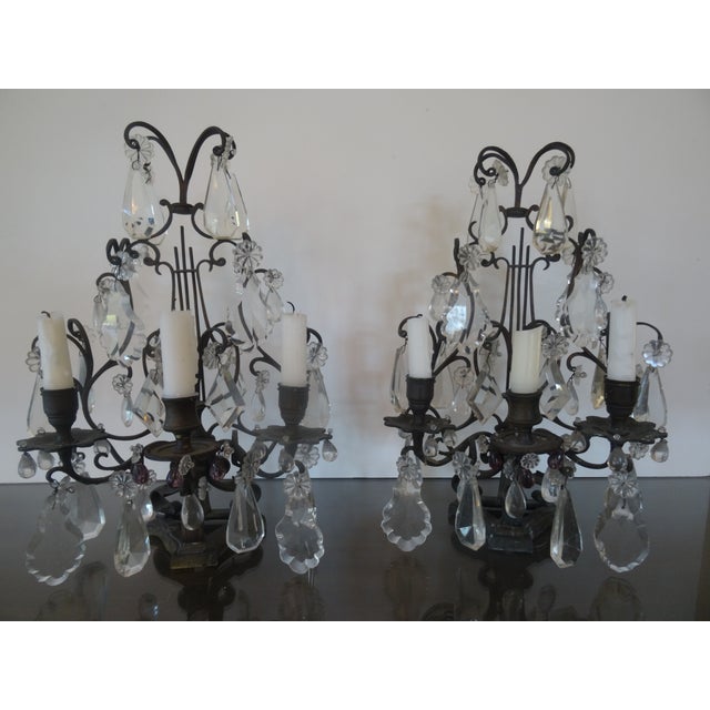 A fabulous pair of late 19th century bronze 3 candle girandoles from Italy.