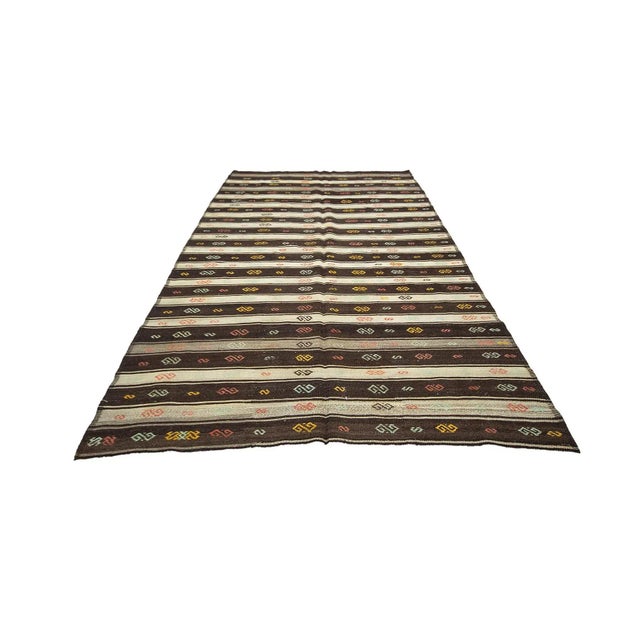 Vintage handwoven decorative kilim rug from Afyon region of Turkey. Approximately 50-60 years old. In very good condition.
