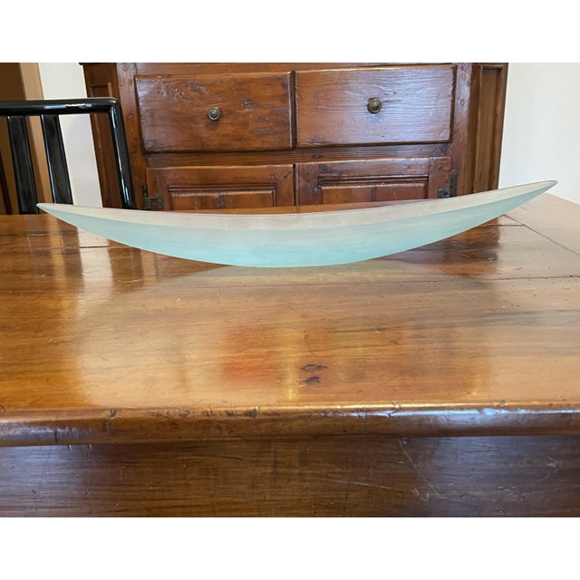 A blue canoe made by Venini based on a design by Tobia Scarpa. This piece is part of the Battuto series created by Tobia...