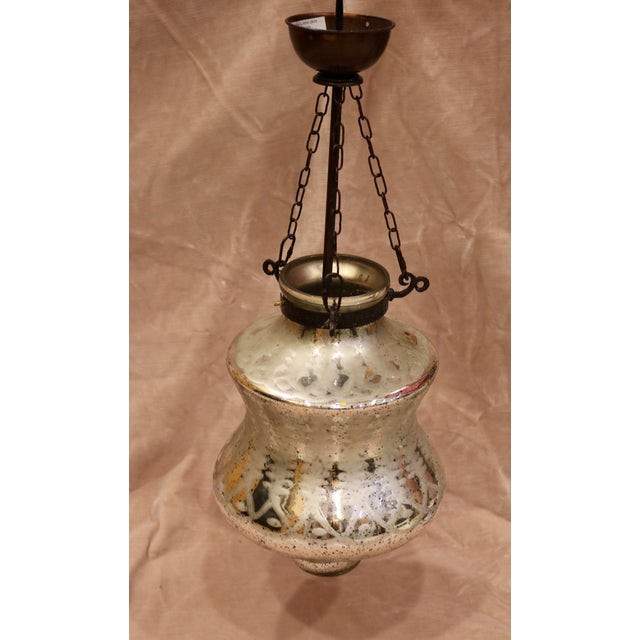 Vintage Mercury Glass Pendant Light Fixture. The fixture is 22 inches tall from the ceiling cap to the bottom of the glass.