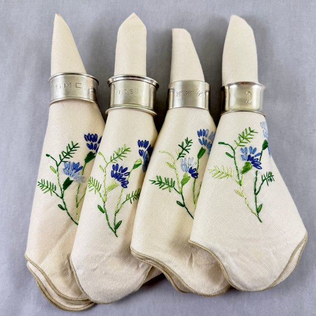 An assembled set of four vintage wide band Sterling Silver napkin rings, various makers, circa 1920s – 1930s. Wonderful...