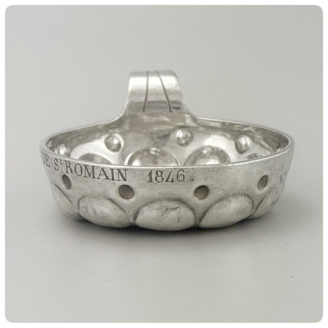 Engraved "F. Tiercin De St. Romain 1846" A tastevin is a small, shallow, silver cup traditionally used by wine...