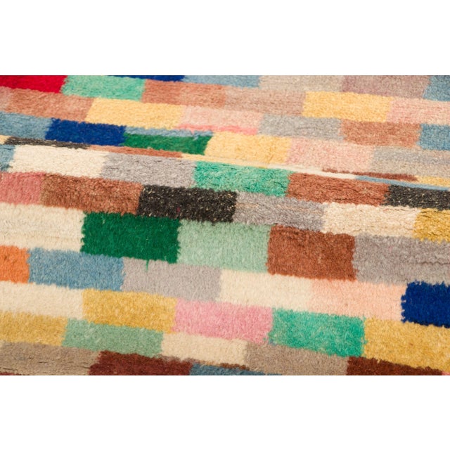 Hand-knotted in wool, this 5x11 vintage Turkish runner, originating circa 1950-1959, showcases an energetic, pixelated...