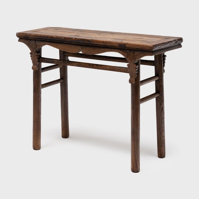 This rustic console table from China's Shanxi province follows the classic recessed-leg form, defined by its inset legs,...