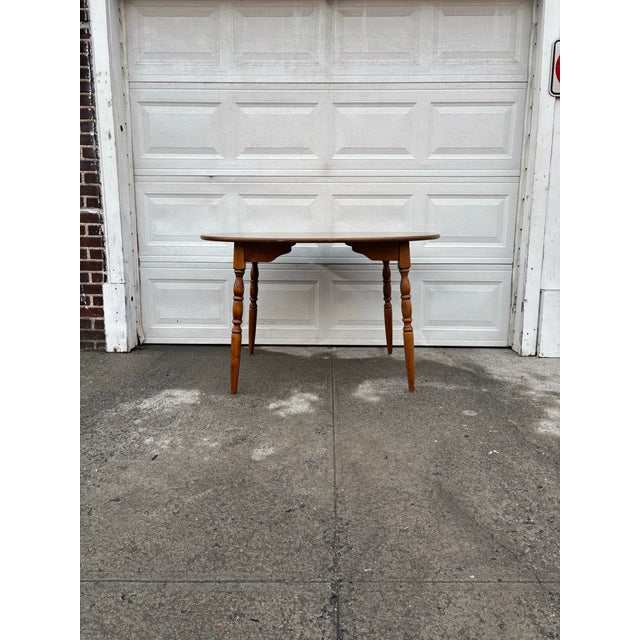 We have a beautiful, vintage oval dining table for sale. It dates back to the mid-20th century and features classic Early...